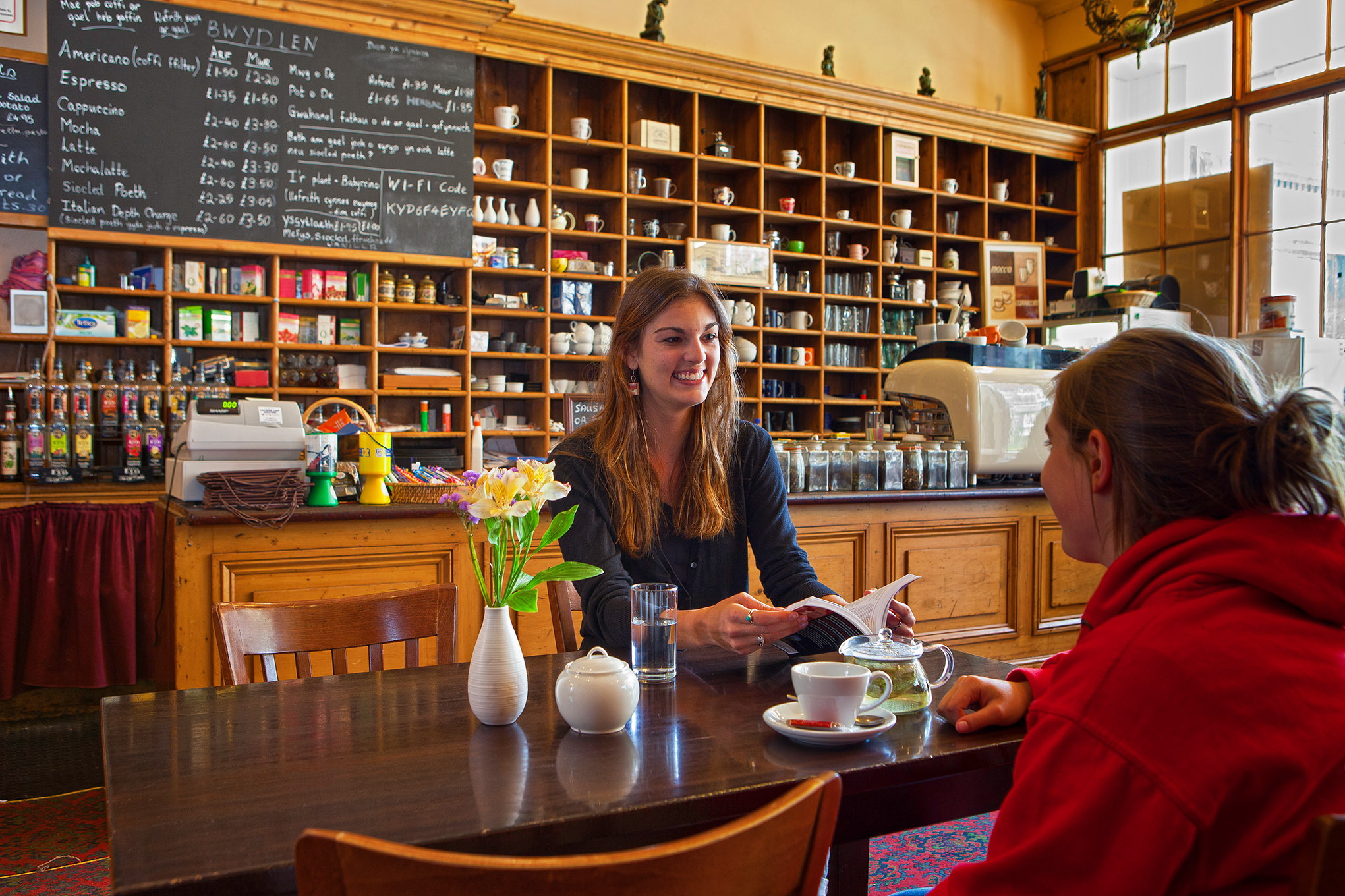 Two people chatting and looking at Wales guidebook
T H Roberts cafe and tea room
Dolgellau
Gwynedd
Mid
Towns and Villages